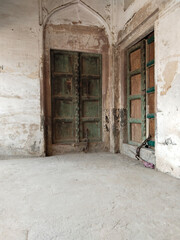 Fototapeta premium Antique Indian style Wooden Door at Ramnagar fort varanasi India. Mughal architecture