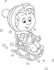 Little boy on his small sled sliding down a snowy slope of a hill on a playground in a winter park, black and white outline vector cartoon illustration for a coloring book