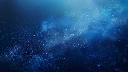 Fototapeta premium A serene Christmas blue background featuring softly falling snowflakes and subtle gradients that transition from light to darker blue hues, evoking a peaceful winter night