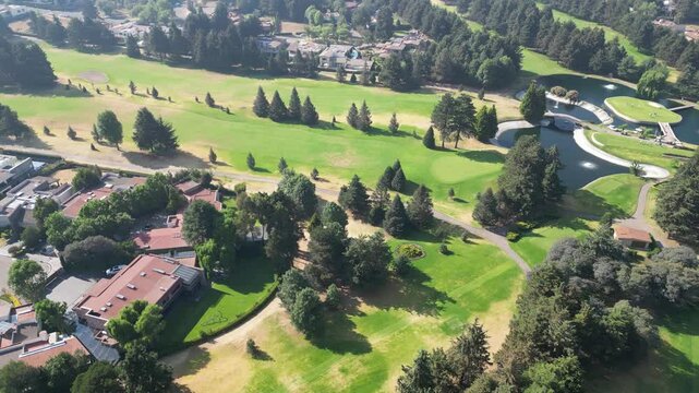 Golf course with a residential area in the background