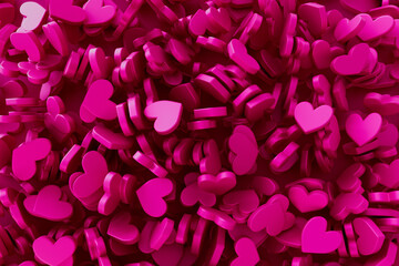 A close up of many pink hearts scattered across a surface