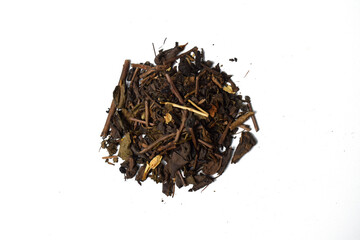 Dried tea leaves pile isolated on a white background, view from above. Top view.