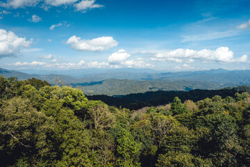 Landscape of forest and green mountains and clear sky in tropical winter.