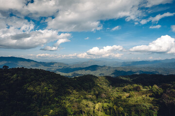Landscape of forest and green mountains and clear sky in tropical winter.