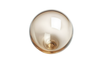 Transparent glass orb resting on a white surface reflecting light in a modern indoor setting