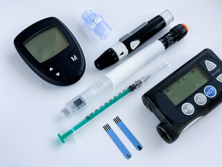 Essential diabetic medical tools. Glucometer, insulin pen, pump, and test strips