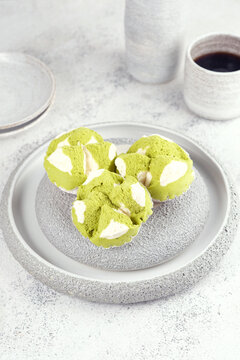 Roti kukus is a soft, fluffy Indonesian steamed bread, often flavored with pandan, chocolate, or sweet fillings, enjoyed as a snack or breakfast.