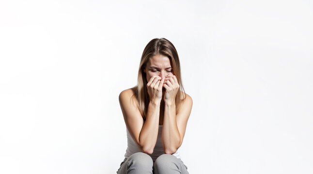 Woman showing emotion of depression, fatigue, emotional burnout on white background. Mental health