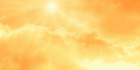 A soft and hazy yellow sky, with fluffy white clouds illuminated by the warm glow of the sun