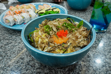 Gyudon or slice beef rice bowl and sushi on the plate. Japanese food.