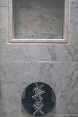 Super deluxe black and white marble bathroom of suite stateroom cabin onboard luxury ocean liner cruiseship cruise ship with sink, mirror, towels and whirlpool bath tub and rain shower 