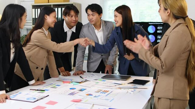 Business team congratulating ceo after successful deal, Celebrating a significant achievement in office. Coworker express excitement and joy while congratulating their colleague.