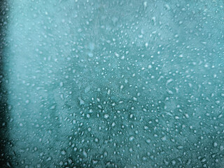 A blurry image of a blue sky with many small white dots. The image has a dreamy, ethereal quality to it.