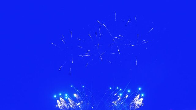 Abstract Real Firework on blue screen chroma key background, 4th of July independence day and new year eve 2024 concept. High quality 4k chromakey slow motion cinematic video