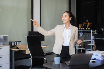 Portrait of a successful business woman with inspiration from their excellent financial results front at the desk.