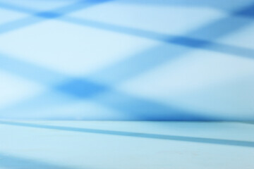 pastel blue background for product display or mock up with shadow and light.