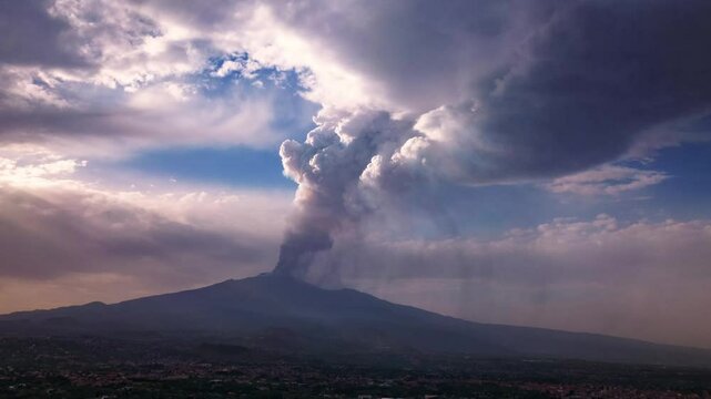 Aerial ascending hyperlapse of Mount Etna in Sicily with smoke from the crater during eruption