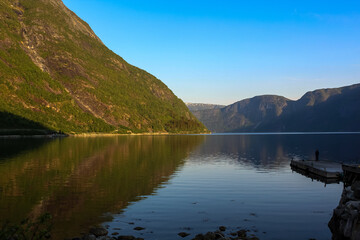 reflection of the sky and mountains in the fjord - Eidfjord