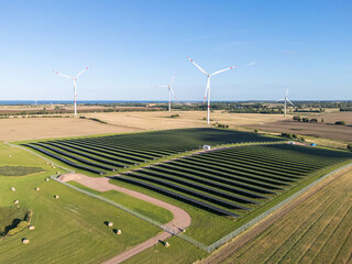 Wind and solar park turbine renewable energy power aerial view photo at the Baltic Sea near...