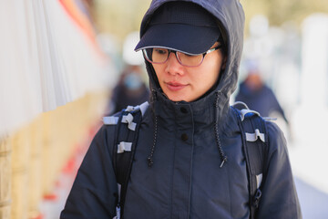 One Tibetan lady Spin the Tibetan Prayer Wheels in Potala place,Lhasa,China