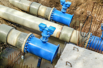 New fiber glass water pipeline in trench. Replacement of old rusty tubes by new one
