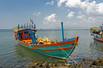 Fototapeta premium Crab fishing boat resting on the shore in Ket, Cambodia