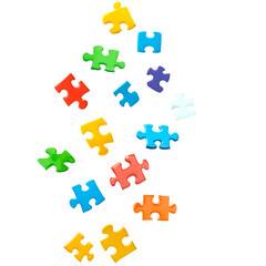 Naklejka premium scattered colorful puzzle pieces floating in mid air