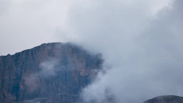 A view of the Dolomites from Campitello di Fassa into Val di Fassa - Timelapse