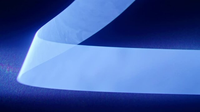Temporal aliasing blue laser slow spiral effect in smoke creates an eerie ominous science fiction high-tech look for scifi motion graphic asset. Streaks of light move upwards with suspense, centered.