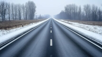 Winter Highway Stretching Towards a Misty Horizon