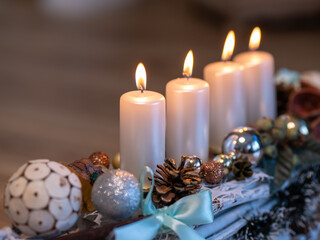 The symbol of Advent is an Advent wreath with four candles. The fourth Advent candle carries the message of Love