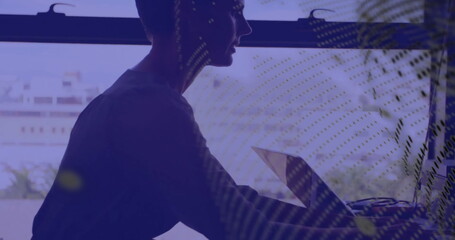 Image of globe and data processing over caucasian businesswoman using computer in office