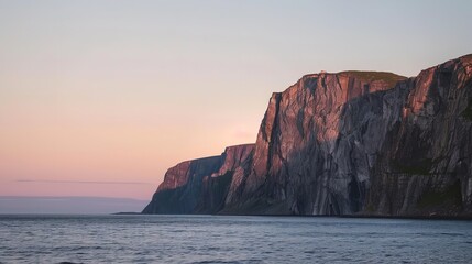 The sun is shining at midnight over the picturesque Tungeneset cliffs on Senja island in northern Norway on a pleasant, serene summer evening, Generative AI.