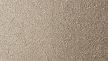 Beige textured cardstock.A textured paper surface with a rough, uneven and weathered pattern to create scrapbooks or simulate canvas in your projects
