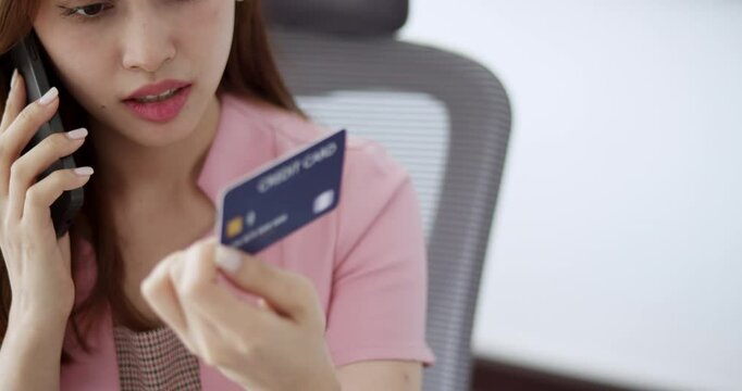 A woman contacts a credit card service center to address data theft issues, confidently discussing preventive measures and solutions for improved security.