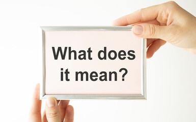 Text What Does It Means question. Concept meaning asking someone about meaning you do not understand Man holds empty paper with copy space in front of him Copy Space.