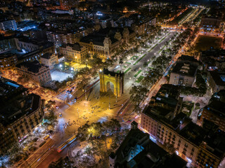 Obraz premium Aerial night view of the illuminated skyline of Barcelona with landmark Arc de Triomf, Spain