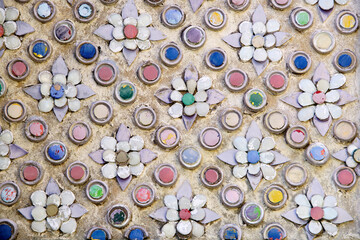 Colorful floral patterns on textured wall in artistic design