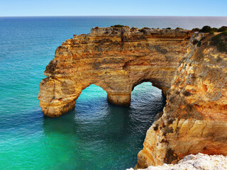 Algarve Portugal. Scenic sea cliffs and natural bridge.