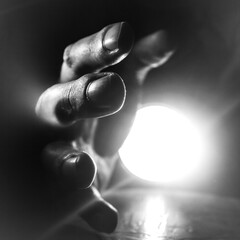 Hand reaching for help, close-up.