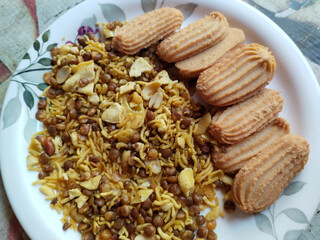 Indian snack: Mixture, Biscuit and Spicy Namkeen in plate for guests