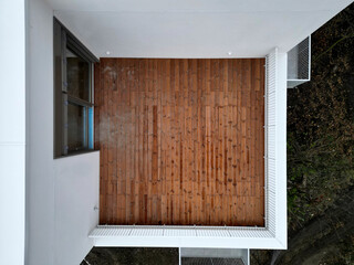 terrace on the balcony made of simple planks. roof garden custom construction. top view for...
