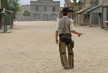 almería poblado del oeste vaquero preparado para hacer un duelo con la pistola en la mano...