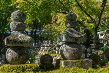 Japanese type of Buddhist pagoda (gorinto) in the form of a structure of five stones of various shapes on the territory of the Buddhist temple of Adashino Nenbutsuji, Kyoto, Japan