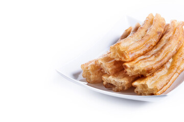 Spanish Churros. Traditional spanish food isolated on white background. cOPY SPACE