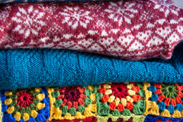 Stack of beautiful multi-colored knitwear