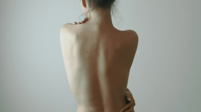 Very pretty woman ran her hands gently over her body