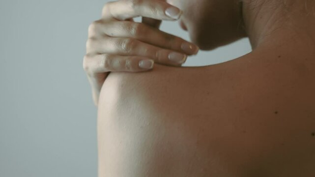 Very pretty woman ran her hands gently over her body