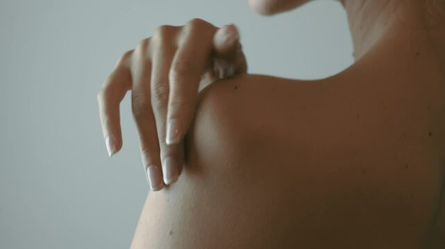 Very pretty woman ran her hands gently over her body