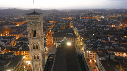 Florence, Italy at dusk. Campanile bell tower viewed from Duomo of Cathedral Cattedrale di Santa...